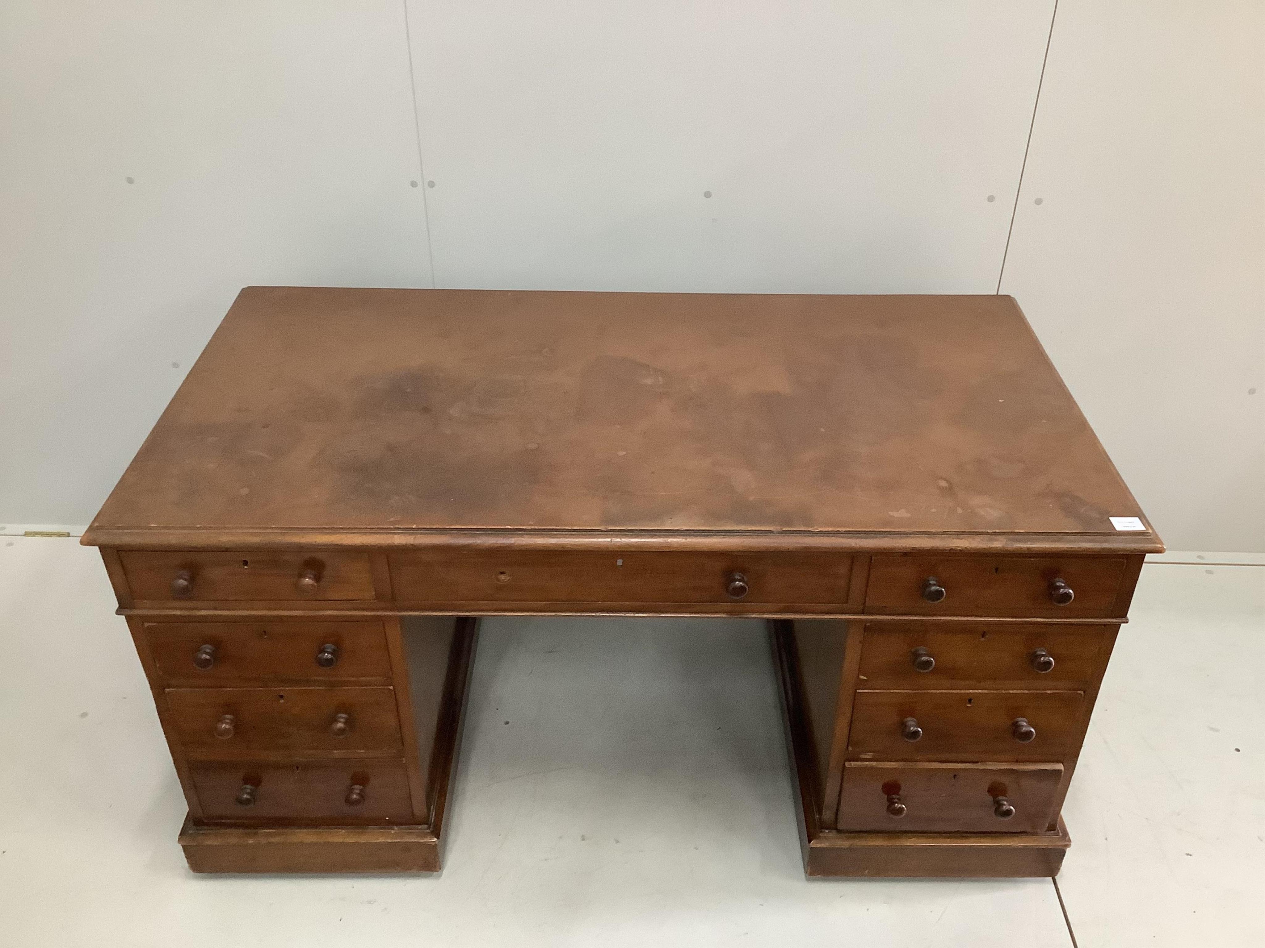 A Victorian mahogany pedestal desk, fitted eight small drawers, boarded top, width 151cm, depth 79cm, height 76cm. Condition - poor